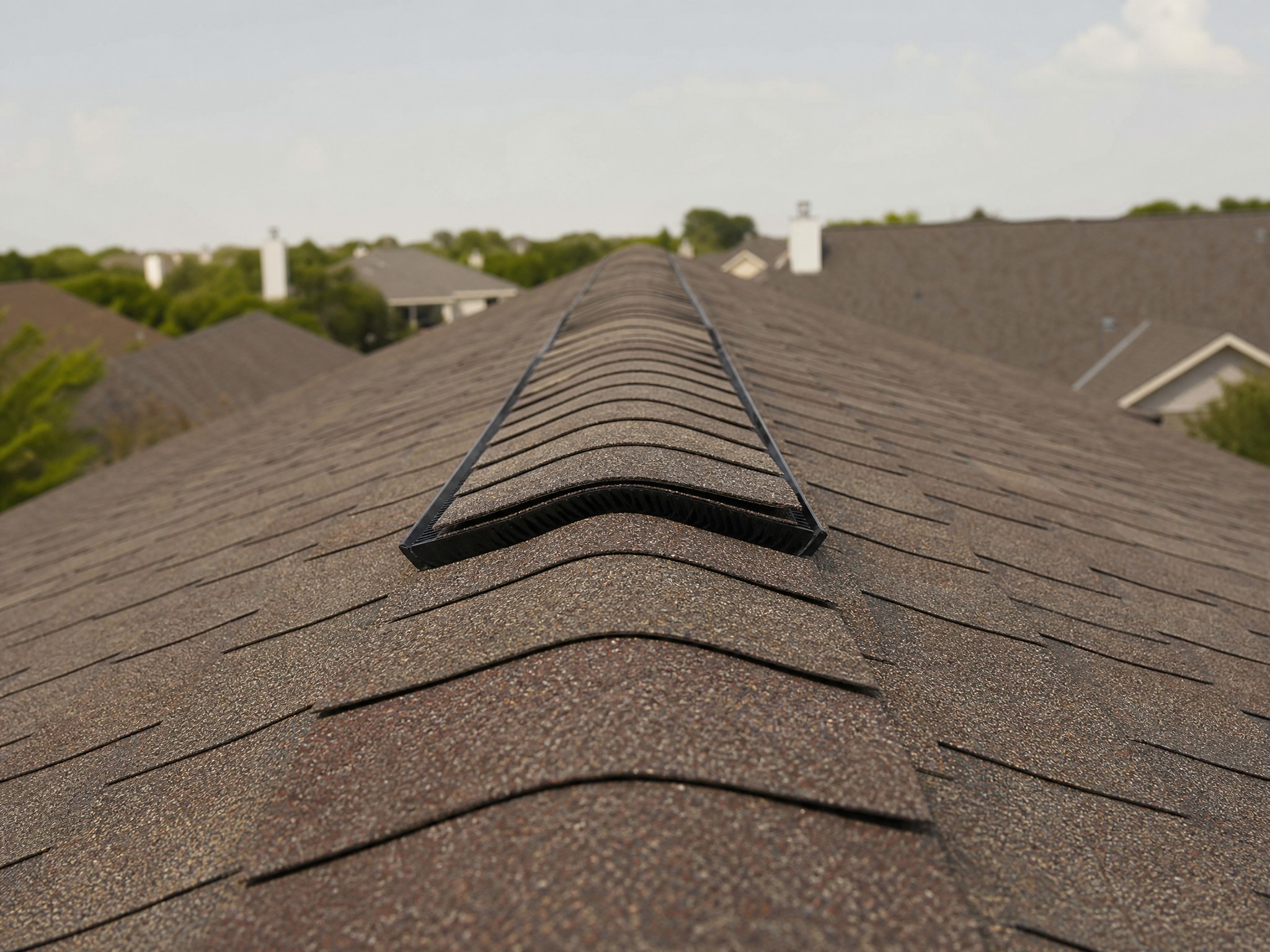 Ridge vent along the peak of a Central Texas home roof