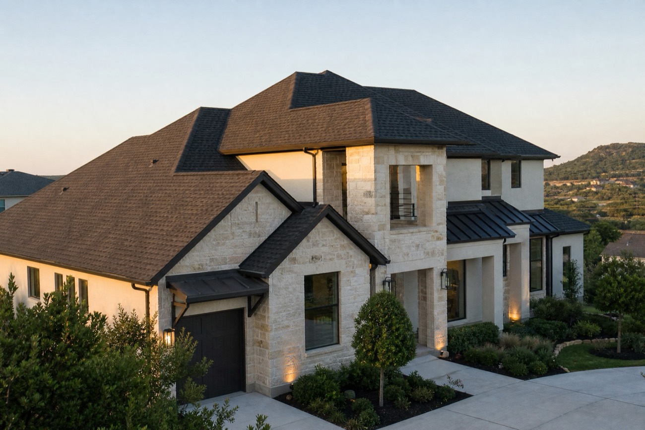 New charcoal architectural shingle roof on a modern two-story Central Texas home